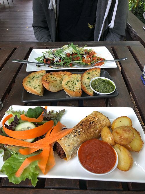 Pesto bread, stuffed sweet potato, and vegan sausage roll at Bamboo Buddha in Holgate