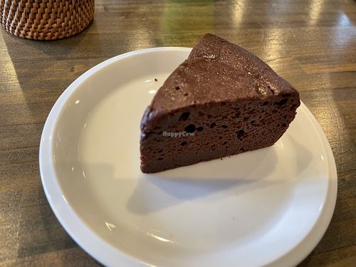 vegan chocolate cake (gateau chocolat). my daughter didn't like it that i took it away from her to take a pic..  at Pennennolde ぺんねんのるで in Chitose