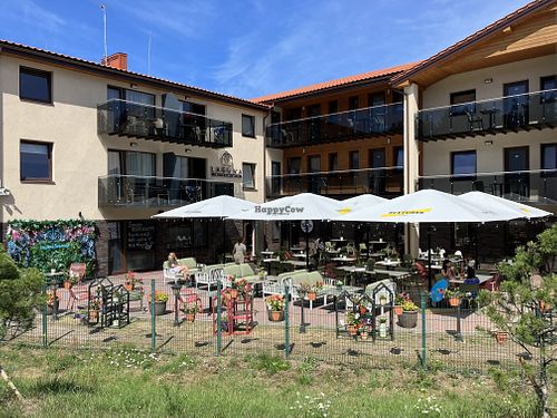There is an outside terrace  at Lagūna Restaurant-Terasa in Palanga
