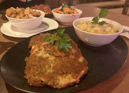 Vegan ‘celery’ schnitzel with potato salad, roast potatoes and hot vegetables   at HeimWerk Tal in Munich