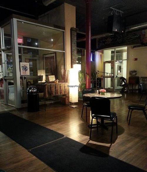 View from the booths towards front door and area with mic. at Downtown Central Perk in Davenport