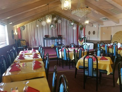 tables and stage at Taj Cuisine of India in Oklahoma City