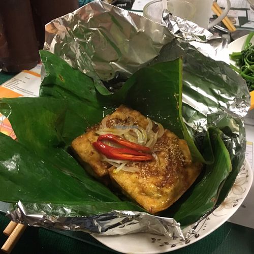 Grilled tofu stuffed with mushrooms in banana leaf at Minh Hien in Hoi An