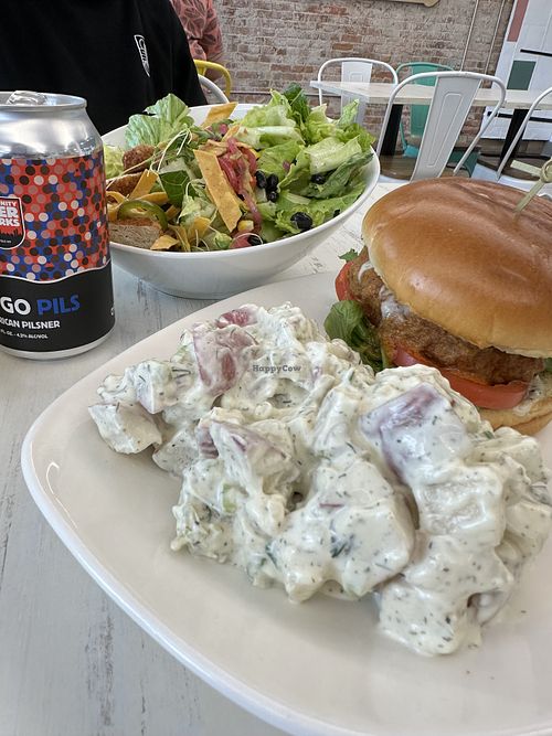 Southwest Chicken salad; Buffalo Bleu fried chicken sandwich with side dill potato salad.   at Strong Hearts in Buffalo