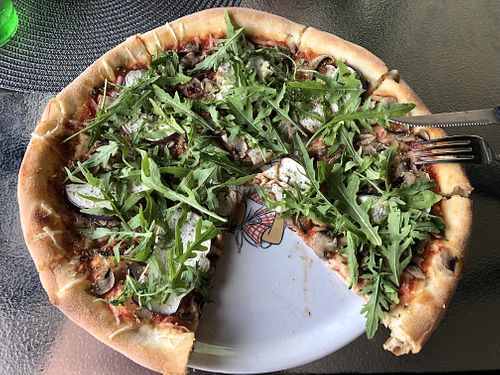 Rikolina, took a bite before taking a photo 🙈😂  at Pizzeria Piccolina in Osijek