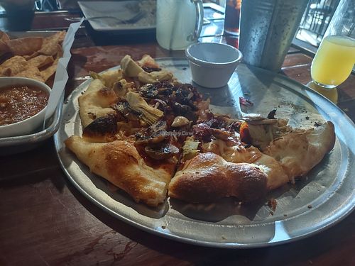 Pizza with veggies and vegan cheese. (Sorry we ate half before taking pics) at Off The Rails Brewing in Pocatello