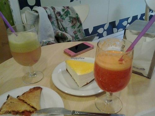 Fresh squeezed juice, lemon mousse cake and empanada.  at Tres Semillas in Alicante
