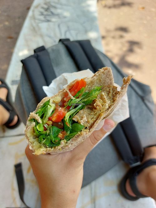 Custom piadini. Whole wheat dough, seitan, vegan cheese, pesto with veggies and olives. SO GOOD! at Vegan Come Koala in Pisa