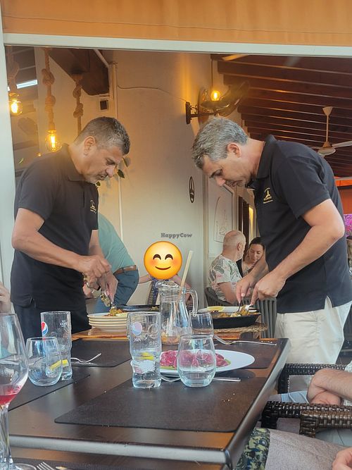 Serving the paella at Alcanada 35 in Mallorca