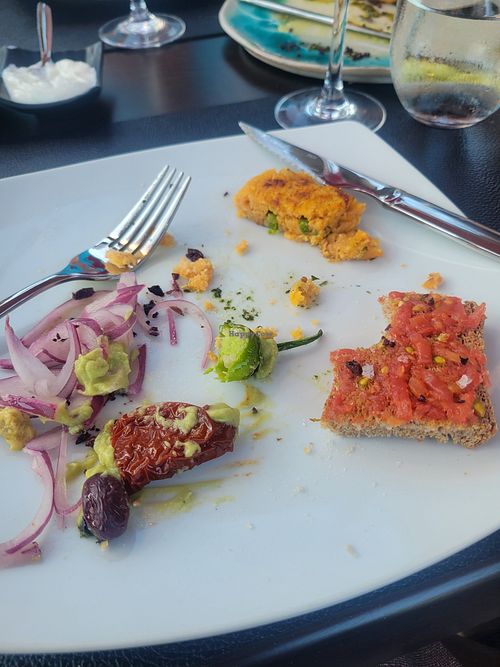 Remnants of the tapas after I forgot to take a picture. Pan con tomate and potato croquettes at Alcanada 35 in Mallorca