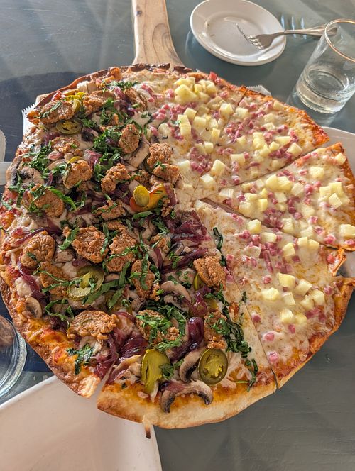 Half Hawaiian, half vegan pizza (caramelized onions, beyond sausage, cheese which tastes like daiya), jalapenos)  at Yachtsman Grill in Cotton Ground