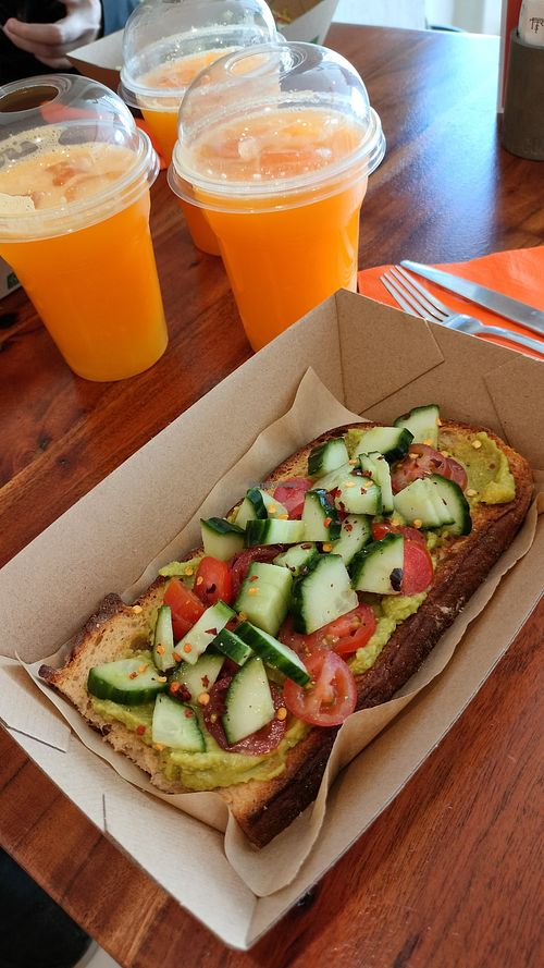 Avocado toast with orange juice at Bohemia The Journey in Santorini