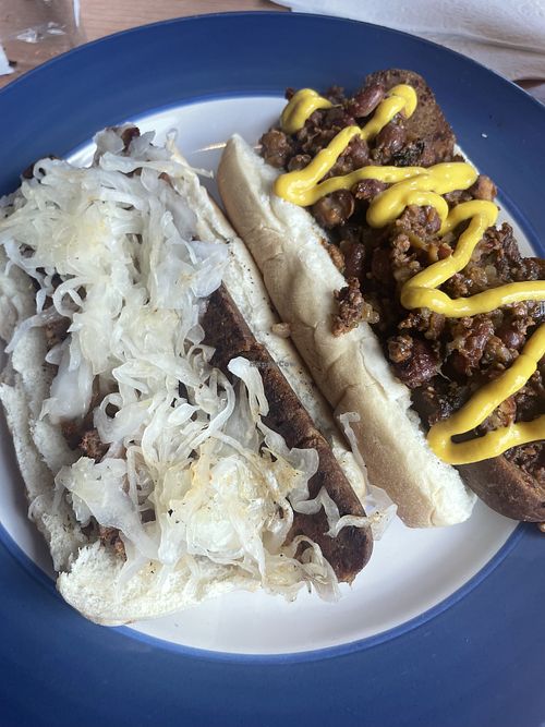 Vegan dogs- build your own. One with sauerkraut and the other with vegan chili and mustard   at Un Mundo Café in Springfield