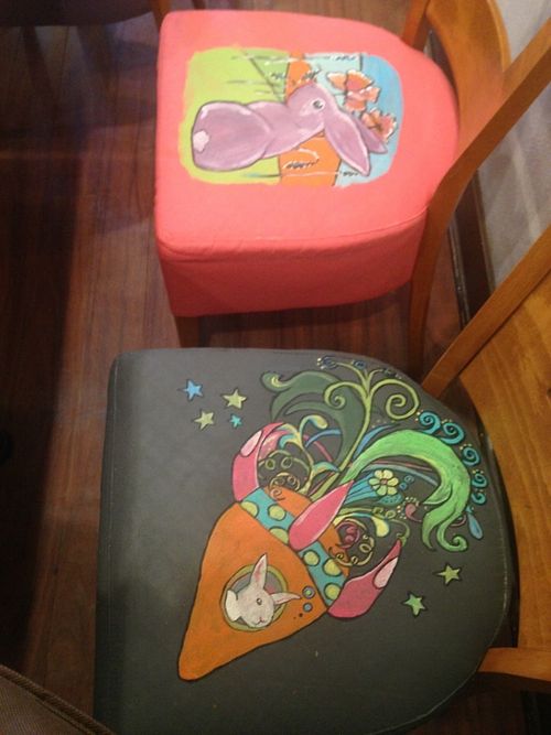 Each chair seat cover has a uniquely painted rabbit design by the owner Tessa! Lots of other beautiful artwork displayed in the restaurant also!  at The Clever Rabbit in Edmonton