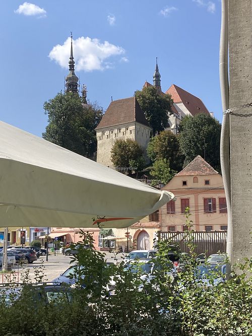 View of the Citadel (behind umbrellas)  at Quattro Amici in Sighisoara