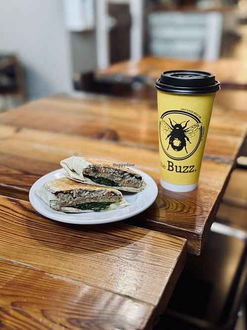 Brekky Burrito and sweet matcha almond milk latte. All vegan for me and absolutely delicious!   at The Buzz Cafe in Kenosha