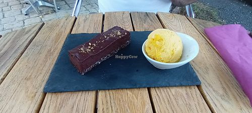 Raw chocolate cake with orange ice cream at Le BarOmÊtre in Champniers