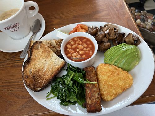 Their vegan breakfast was amazing and included sunflower butter for the toast. They have oat milk for all their coffees. The location is right on the water   at Bandstand Brighton in Brighton