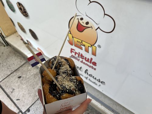 Fritule with chocolate sauce and crushed hazelnuts   at Jeti Sweet House Zadar in Zadar