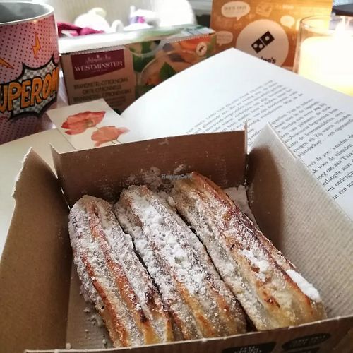 Coco churros (should be cinnamon sugar instead of powdered). This item is not my fave. The dough inside is a bit undercooked. The ooey chocolate filling is good at Domino's Pizza - Floresstraat in Groningen