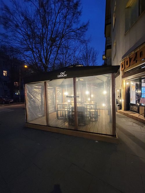 Outside eating at Dozo Vegan Ramen in Warsaw