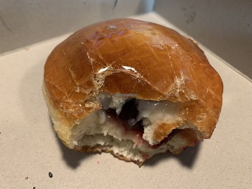 Inside the raspberry crème brûlée donut   at Doughbot Donuts in Sacramento