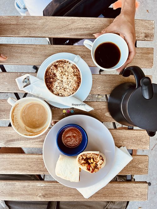 Oatmeal and burrito - oat milk latte and house coffee  at Elevation Coffee in Tampa