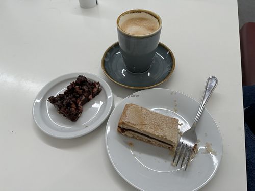Cake + oat latte  at An Lanntair Cafe Bar in Isle Of Lewis