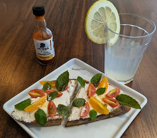 Ricotta and tomato sourdough. This was excellent. at Matuta Queijaria Vegana in Sao Paulo