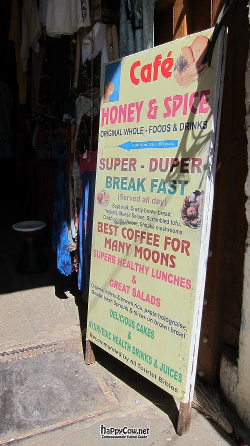 Look for this sign on the street to point you toward the cafe. at Honey and Spice in Pushkar