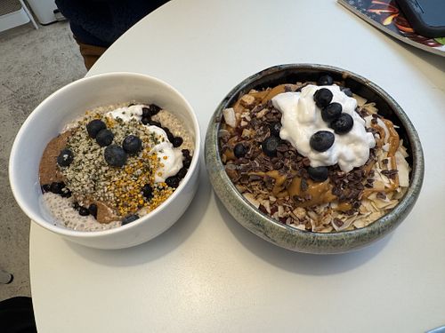 Oat chia bowl and berry peanut smoothie bowl  at Aura Juice in Paris