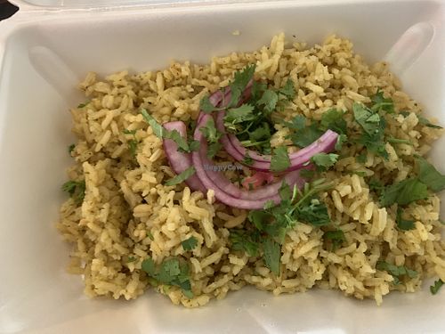 Side of rice topped with cilantro and onions  at The Vegan Vato in Victorville