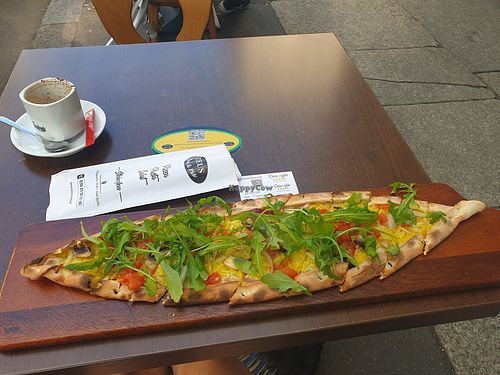 Rucola pide with cappuccino, yummy at Zeus Pizza in Berlin