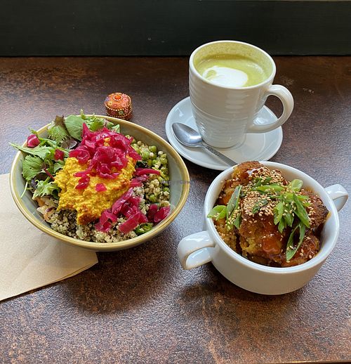 Small salad bowl, matcha latte 💚 and crispy GF cauliflower bites 🧡   at Zappa's in Totnes