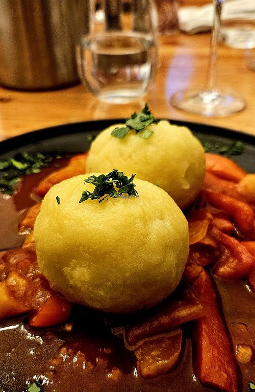 Potato dumplings stuffed with tempeh at Schlicht Vegan in Vienna
