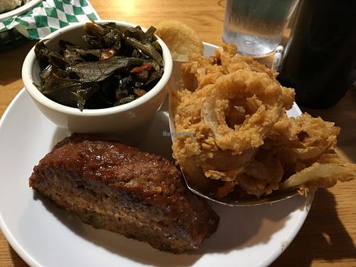 Meatloaf plate with onion rings and collard greens at Bean Vegan Cuisine in Charlotte