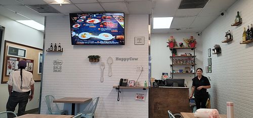 It's small and quaint, but it's a wonderful place. They also serve alcohol for those who are looking for that, as the picture shows. The lady is Angela! at Blue Table Thai Cuisine in Bakersfield
