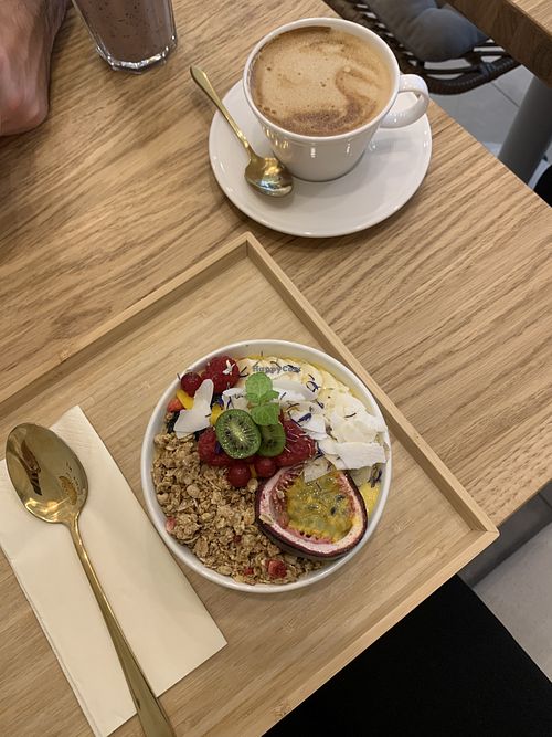 Mango smoothie bowl with flat white (oat milk)   at Soul in the Bowl in Wroclaw