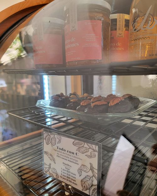 These are SO GOOD! They are dates, covered with a sweet and smooth dark chocolate, topped with pecan or almond. I could live on these! Only 20 pesos each ♡ at Panluna Panadería Vegana - Cafe Piyo in Huatulco