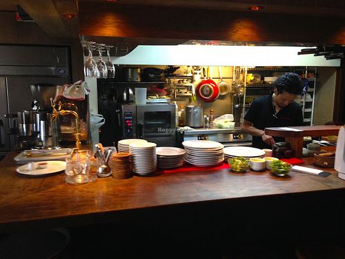 View of the counter and kitchen right next to the entrance.  at Matsuontoko Cafe in Kyoto