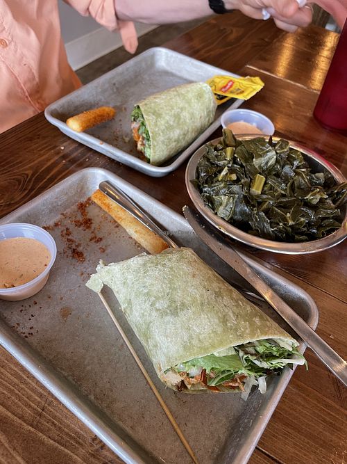 We housed the delicious vegan burger and yucca fries before I remembered to take a picture. Sorry. Pic shows the wrap and huge dish of collards.  at Farm Fresh Fast in Simpsonville