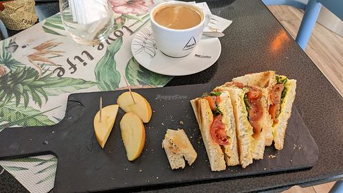 The full menu was not available until noon, but this was quite nice. Vegan "toast": toasted sandwich cut in fourths with vegan butter and cheese, cherry tomatoes, and done manner o at O Secreta in Machico
