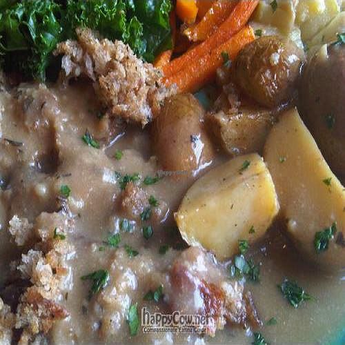 breaded baked seitan plate w/ local organic kale, potatoes, eggplant & squash. at Susty's Cafe in Northwood