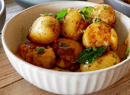 Smashed potatoes with curry mayo   at Otto Champagneria & Beer Hall in Wellington