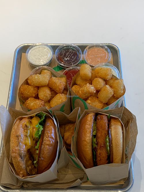 Various sauces, tots, double burg'r, nuggets, and deluxe hot n crispy chik'n sandwich
 at Hart House in Monrovia