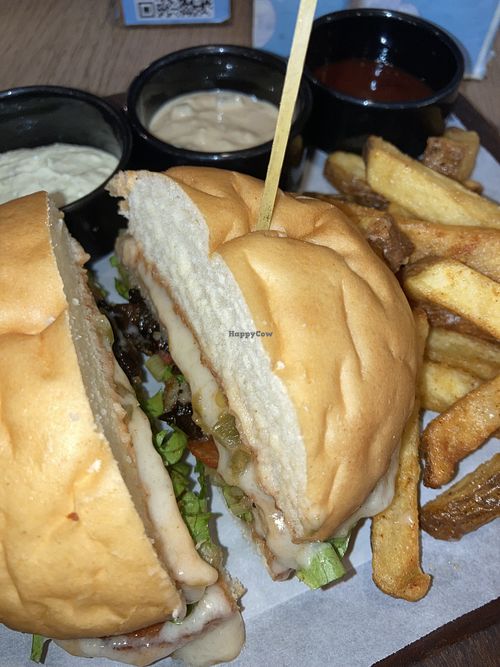 Mock meat and cheese burger with side fries snd dips  at Loci And Toot in Mumbai