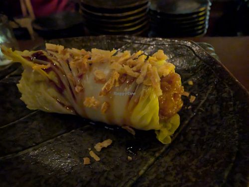 4 - Mochi Inari - 
Grilled Mochi, Inari, Butter Shoyu, Napa Cabbage, Crispy Shallot, Truffle Salt, Sweet Soy Sauce
 at Omakaseed in New York City