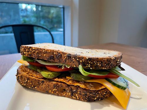 Vegan sandwich with tempeh, avocado, tomato, salad, vegan mayo and vegan cheese! So yummy   at Trees Organic Coffee in Vancouver