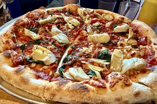 Vegan pizza with artichokes, basil, etc. (ordered without cheese) at Three Rivers Pizzeria in Farmington
