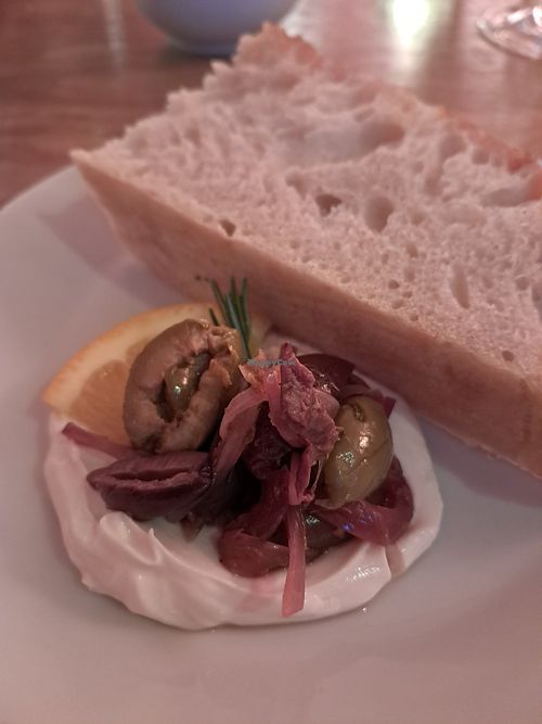 Orange & rosemary marinated olives and focaccia at HAPPA Restaurant in Berlin